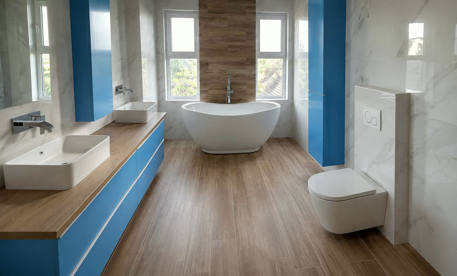 Salle de bain rénovée intégralement par Sani-Chauffe : grès effet marbre, parquet céramique, double vasque et baignoire îlot